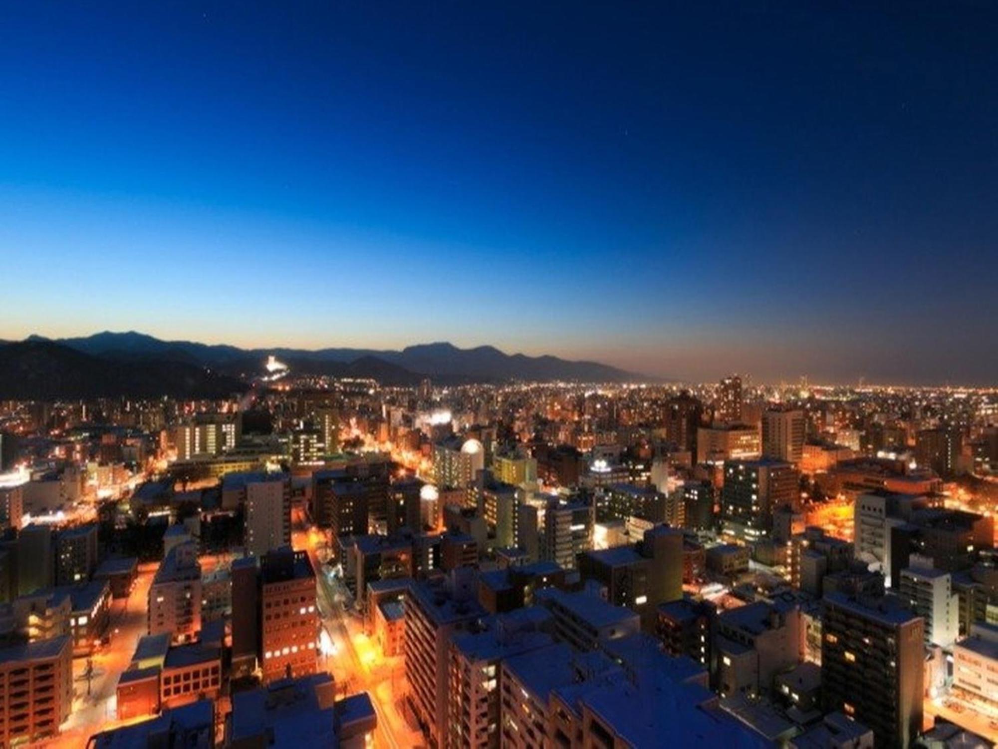 Sapporo Prince Hotel Exteriör bild Santiago skyline at night